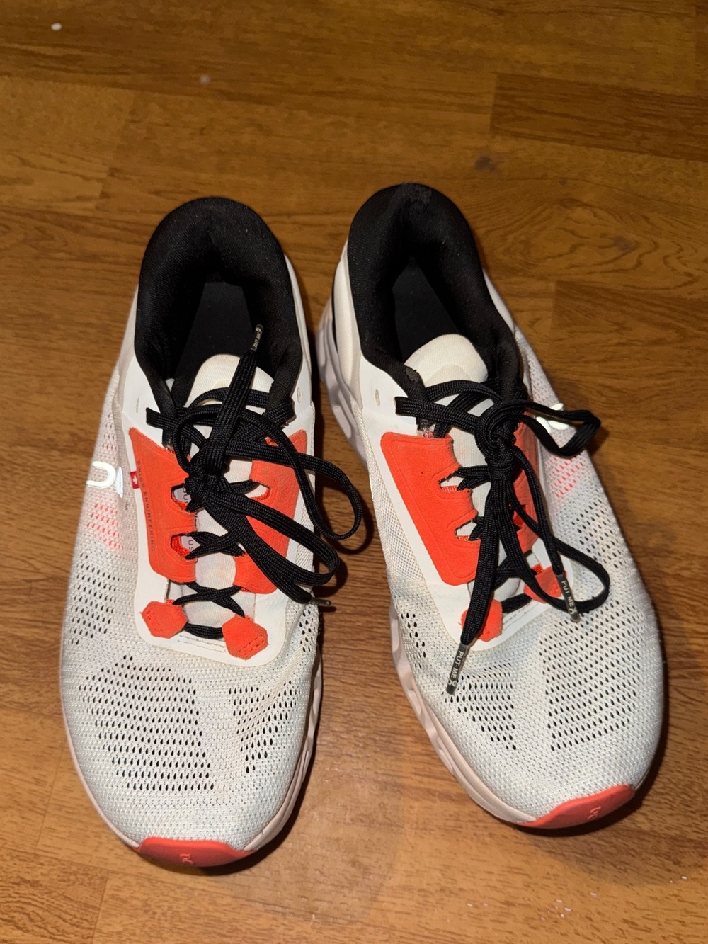 On Cloudstratus 3 running shoes in a white and orange colorway